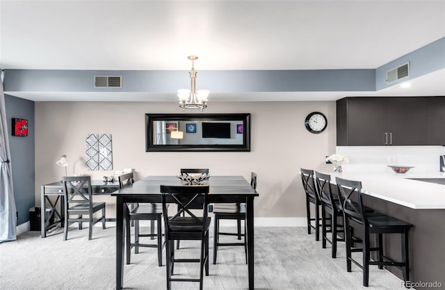 5955 E 10th Ave Unit 507, Denver, CO 80220 - dining area with light carpet and a chandelier