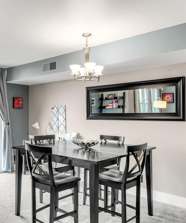 5955 E 10th Ave Unit 507, Denver, CO 80220 - carpeted dining area with a chandelier and baseboards