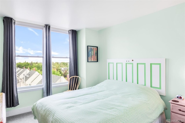 5955 E 10th Ave Unit 507, Denver, CO 80220 - carpeted bedroom featuring baseboards and a water view