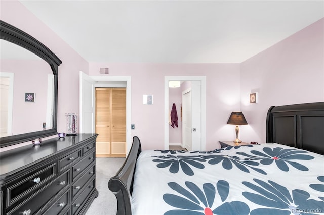 5955 E 10th Ave Unit 507, Denver, CO 80220 - carpeted bedroom with ensuite bath and baseboards