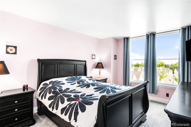 5955 E 10th Ave Unit 507, Denver, CO 80220 - bedroom with light colored carpet and baseboards