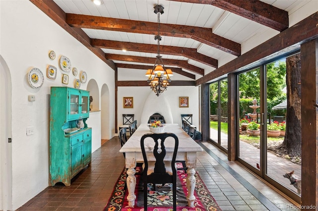 50 Albion St, Denver, CO 80220 - dining room with arched walkways, a chandelier, dark tile patterned flooring, and wood ceiling