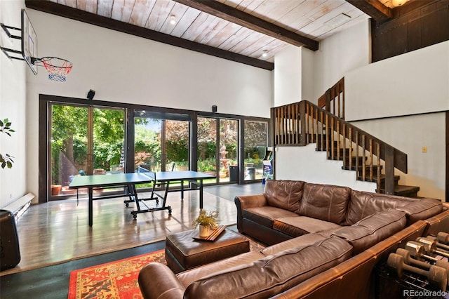 50 Albion St, Denver, CO 80220 - living room featuring a high ceiling, a wood ceiling with exposed beams, stairs, a baseboard heating unit, and wood finished floors