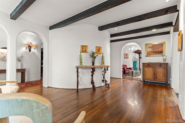 50 Albion St, Denver, CO 80220 - living room with arched walkways, beam ceiling, dark wood-style flooring, and a chandelier
