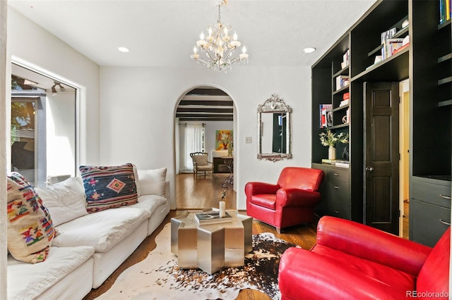 50 Albion St, Denver, CO 80220 - sitting room featuring arched walkways, wood finished floors, a chandelier, and recessed lighting