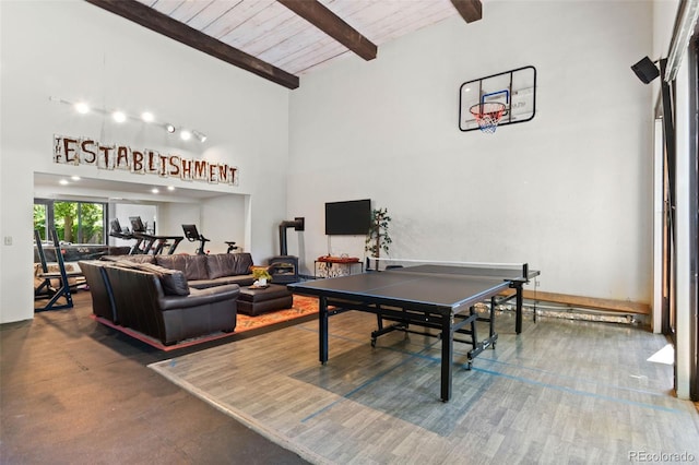 50 Albion St, Denver, CO 80220 - rec room featuring high vaulted ceiling, a wooden ceiling with exposed beams, and a wood stove