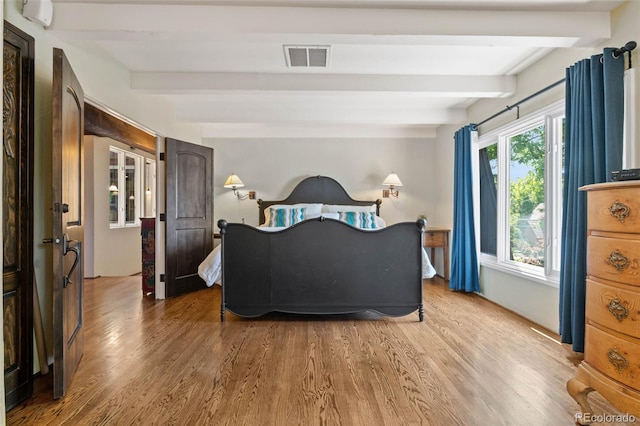 50 Albion St, Denver, CO 80220 - bedroom with beam ceiling and wood finished floors