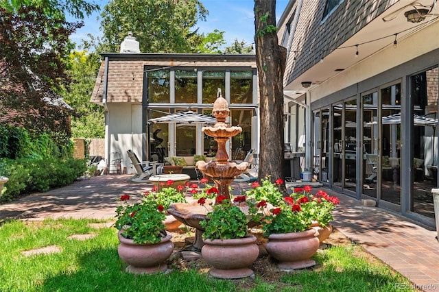 50 Albion St, Denver, CO 80220 - rear view of house with mansard roof, a chimney, and a patio area