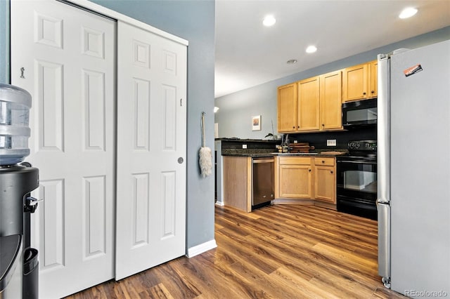 15612 E 96th Way Unit 20B, Commerce City, CO 80022 - kitchen with black appliances, dark countertops, dark wood-type flooring, light brown cabinets, and recessed lighting