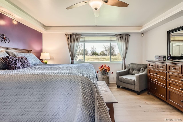 bedroom featuring a ceiling fan and light wood-style floors