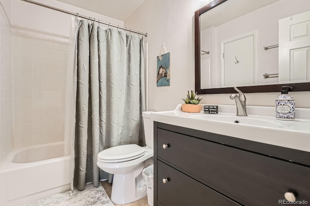 bathroom with vanity, toilet, and shower / bath combo with shower curtain