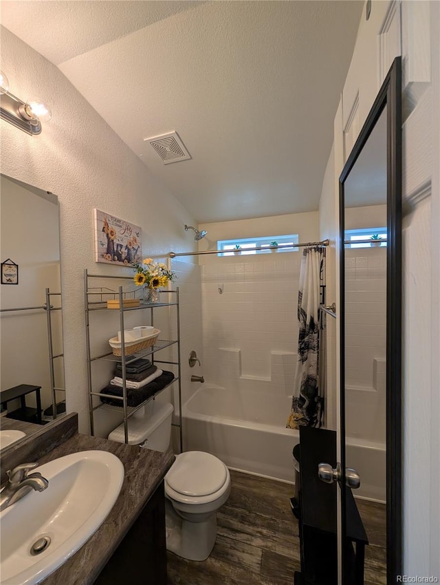 10795 County Road 197a Unit 137, Nathrop, CO 81236 - full bathroom with wood finished floors, vanity, toilet, shower / tub combo with curtain, and lofted ceiling