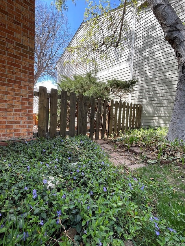 view of side of home with fence