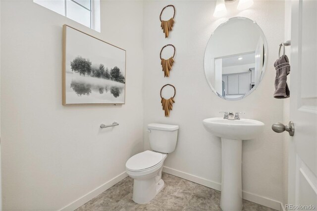 9865 Biscay St, Commerce City, CO 80022 - half bath with baseboards and toilet