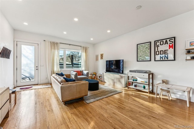 living area featuring recessed lighting and wood-type flooring