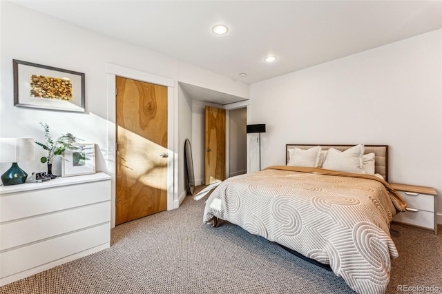 carpeted bedroom with recessed lighting