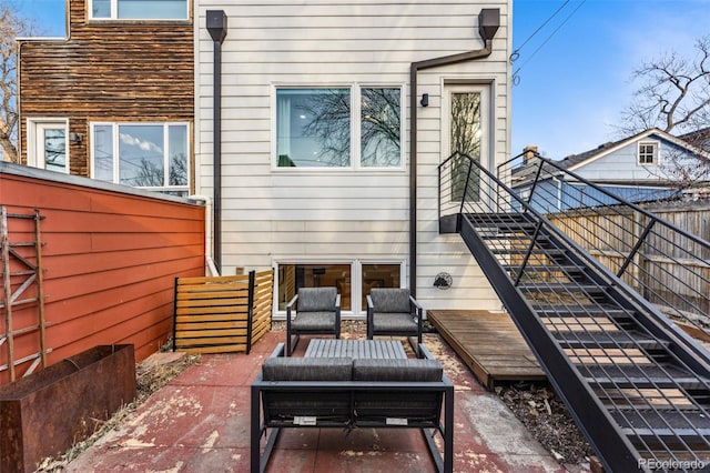 exterior space with outdoor lounge area, stairs, a patio, and fence