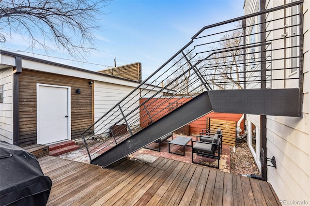 wooden deck featuring entry steps and grilling area