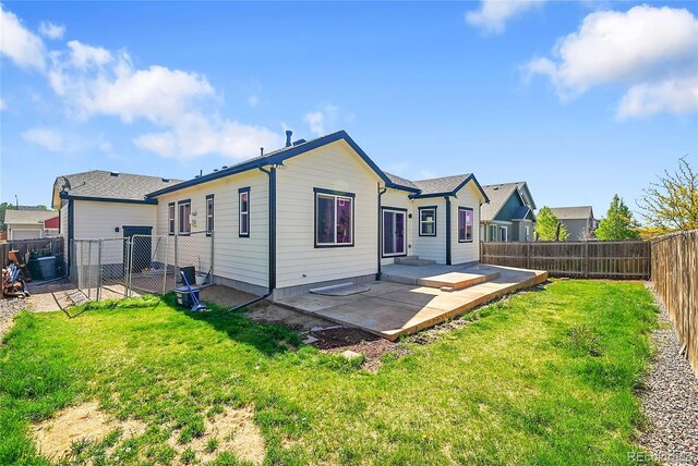 6829 Juniper Ct, Frederick, CO 80530 - rear view of property with a patio area