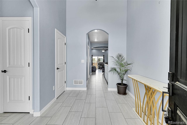 6829 Juniper Ct, Frederick, CO 80530 - hall featuring arched walkways and baseboards