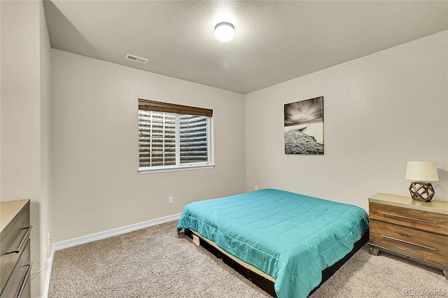 6829 Juniper Ct, Frederick, CO 80530 - bedroom with carpet, a textured ceiling, and baseboards