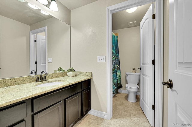 6829 Juniper Ct, Frederick, CO 80530 - full bath with vanity, toilet, tile patterned floors, and baseboards