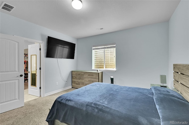 6829 Juniper Ct, Frederick, CO 80530 - carpeted bedroom with a spacious closet and baseboards