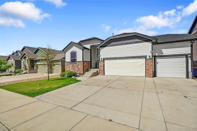 6829 Juniper Ct, Frederick, CO 80530 - view of front of house featuring an attached garage, driveway, stone siding, and a residential view