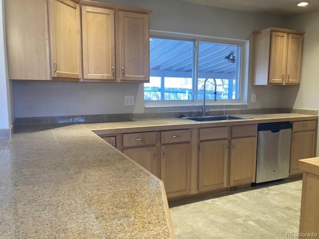 kitchen featuring a sink, dishwasher, and recessed lighting