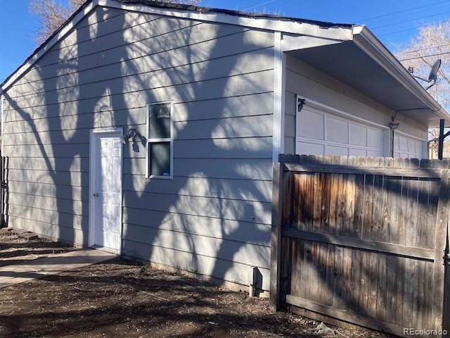 view of side of home featuring a garage