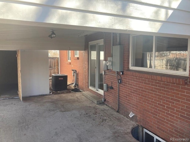 view of patio / terrace featuring a carport and central air condition unit