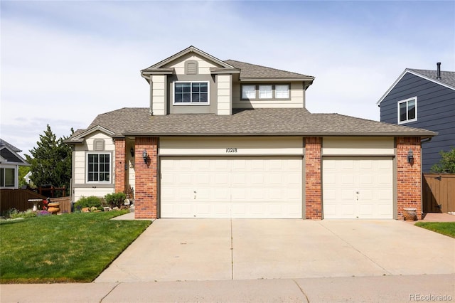 10218 Woodrose Ct, Highlands Ranch, CO 80129 - view of front of house with brick siding, driveway, a garage, and roof with shingles