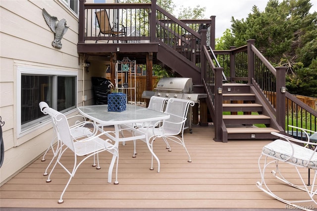 10218 Woodrose Ct, Highlands Ranch, CO 80129 - wooden terrace with stairs, outdoor dining space, and grilling area