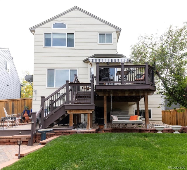 10218 Woodrose Ct, Highlands Ranch, CO 80129 - back of property with a wooden deck and stairway