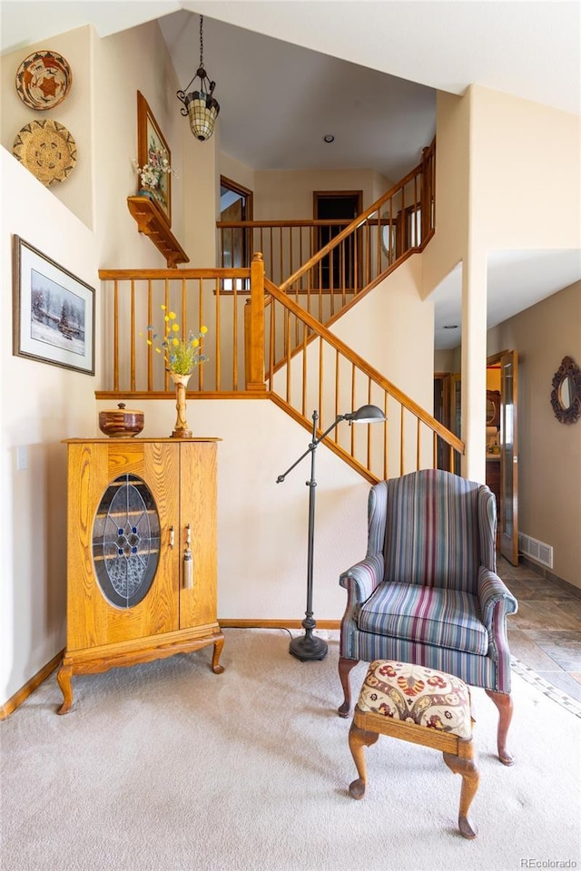 10218 Woodrose Ct, Highlands Ranch, CO 80129 - staircase featuring carpet, baseboards, and a chandelier