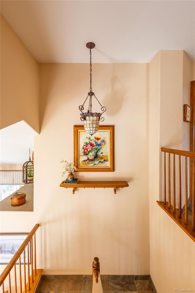 10218 Woodrose Ct, Highlands Ranch, CO 80129 - stairs featuring a chandelier
