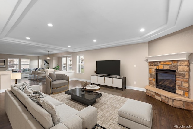 1983 Candleglow St, Castle Rock, CO 80109 - living area featuring baseboards, a tray ceiling, recessed lighting, and dark wood-type flooring