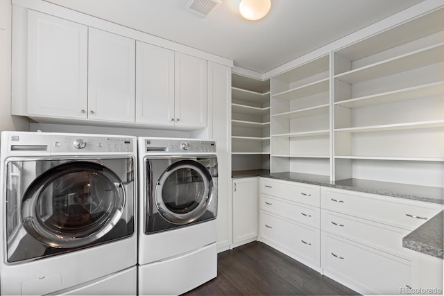 1983 Candleglow St, Castle Rock, CO 80109 - washroom featuring washer and clothes dryer, dark wood-style floors, cabinet space, and visible vents