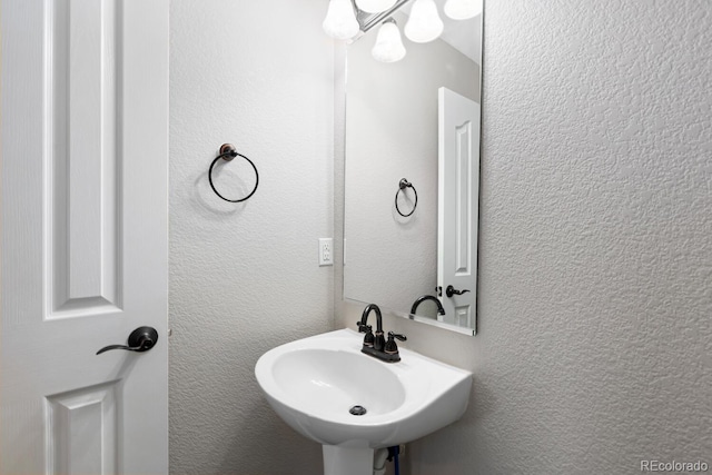 1983 Candleglow St, Castle Rock, CO 80109 - bathroom featuring an inviting chandelier and a sink