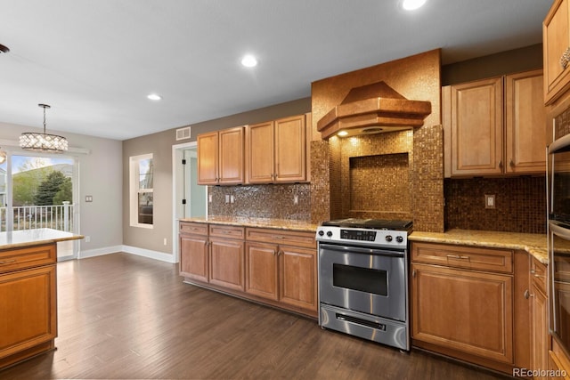 1983 Candleglow St, Castle Rock, CO 80109 - kitchen featuring stainless steel gas stove, premium range hood, recessed lighting, dark wood-style flooring, and backsplash