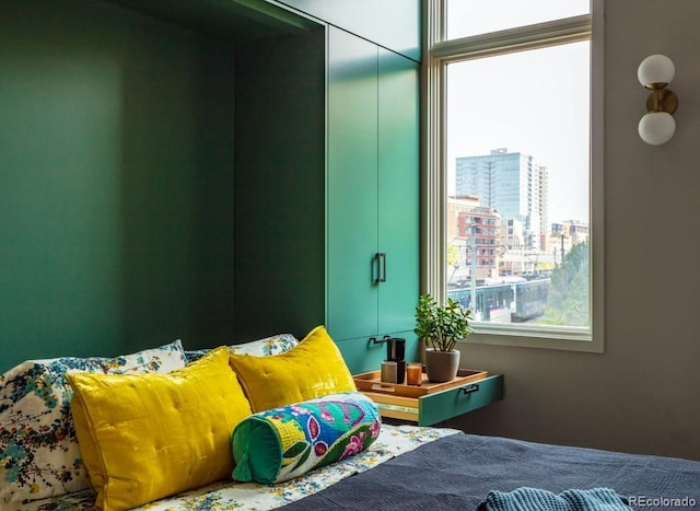 bedroom featuring a city view