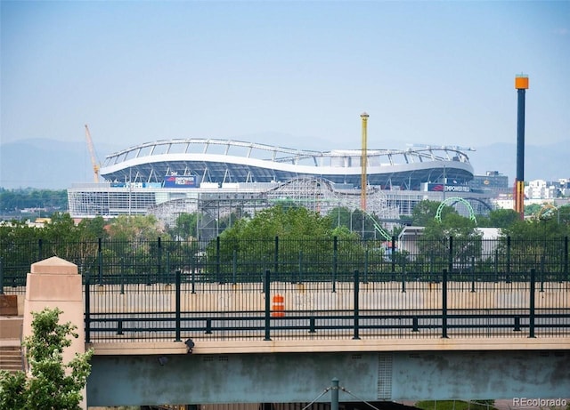 view of home's community featuring a view of city and fence