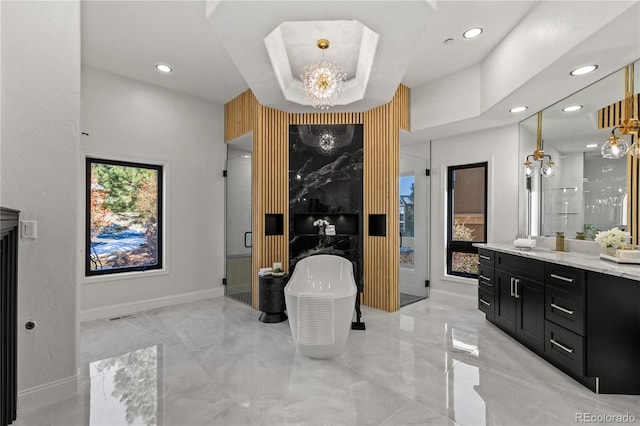 bathroom with vanity and an inviting chandelier