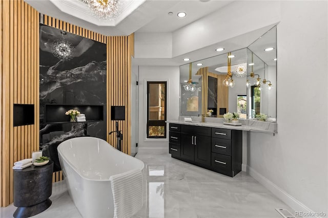 bathroom with a washtub, vanity, and ceiling fan with notable chandelier