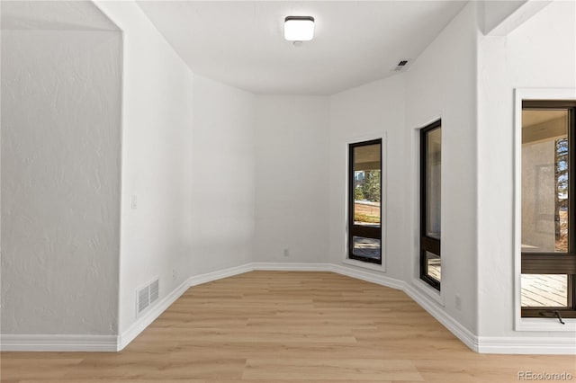 unfurnished room featuring light hardwood / wood-style flooring