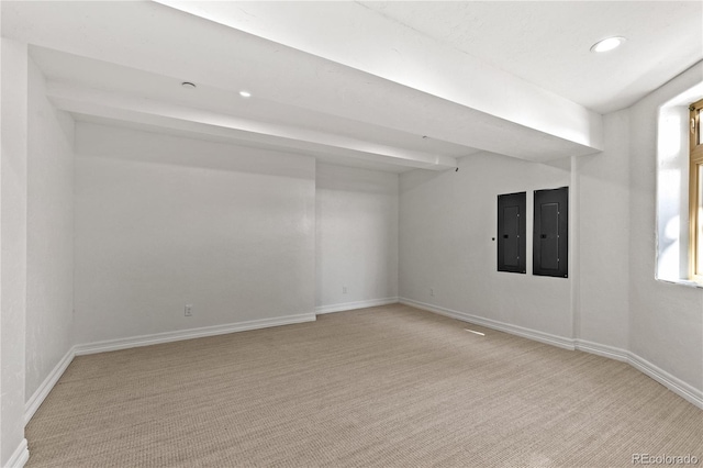 carpeted empty room featuring electric panel