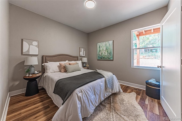 bedroom featuring dark hardwood / wood-style flooring