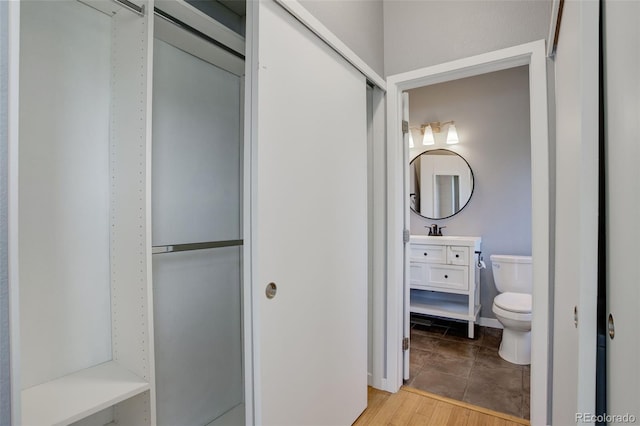 bathroom with toilet and vanity