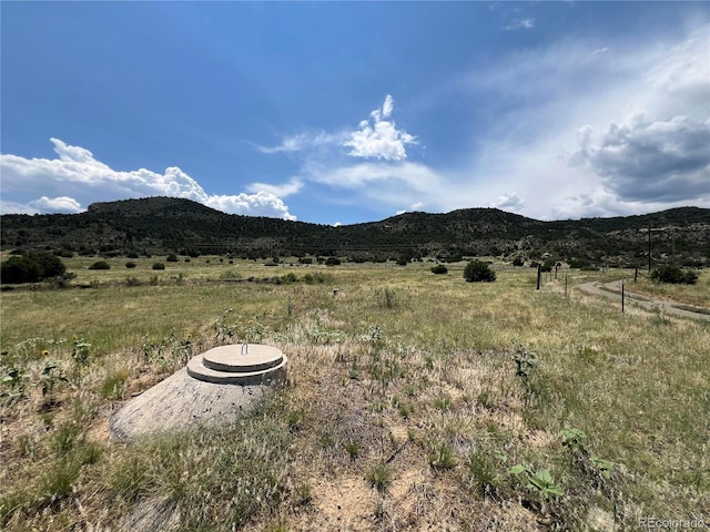 mountain view featuring a rural view