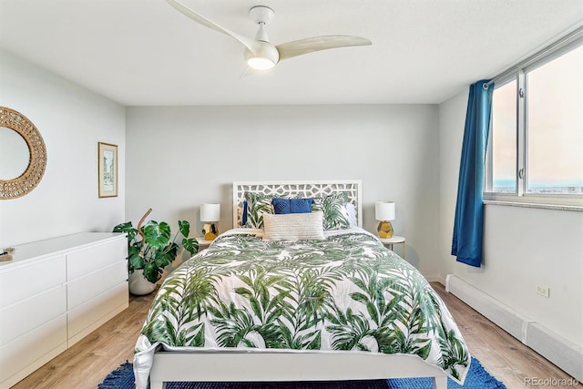 bedroom featuring ceiling fan and light wood-style flooring
